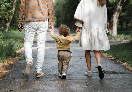 Picture of Parents walking a toddler